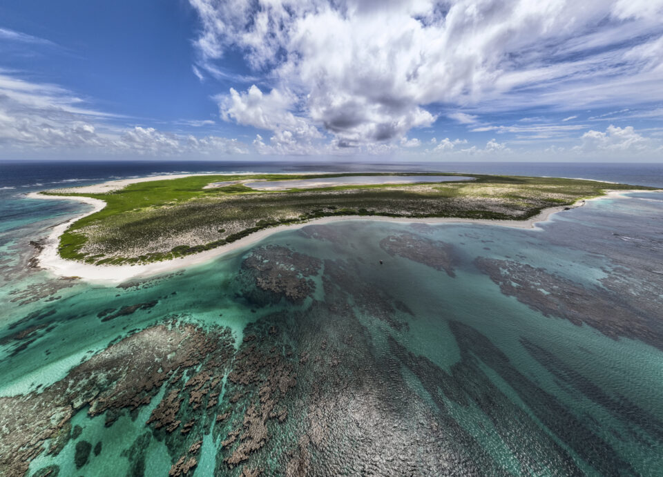 Kamole, also known as Laysan, is about 1 mile wide and 1.5 miles long, the second largest island in the monument. It has a lake in the center that is three times saltier than the ocean. (Nathan Eagle/Civil Beat/2024)