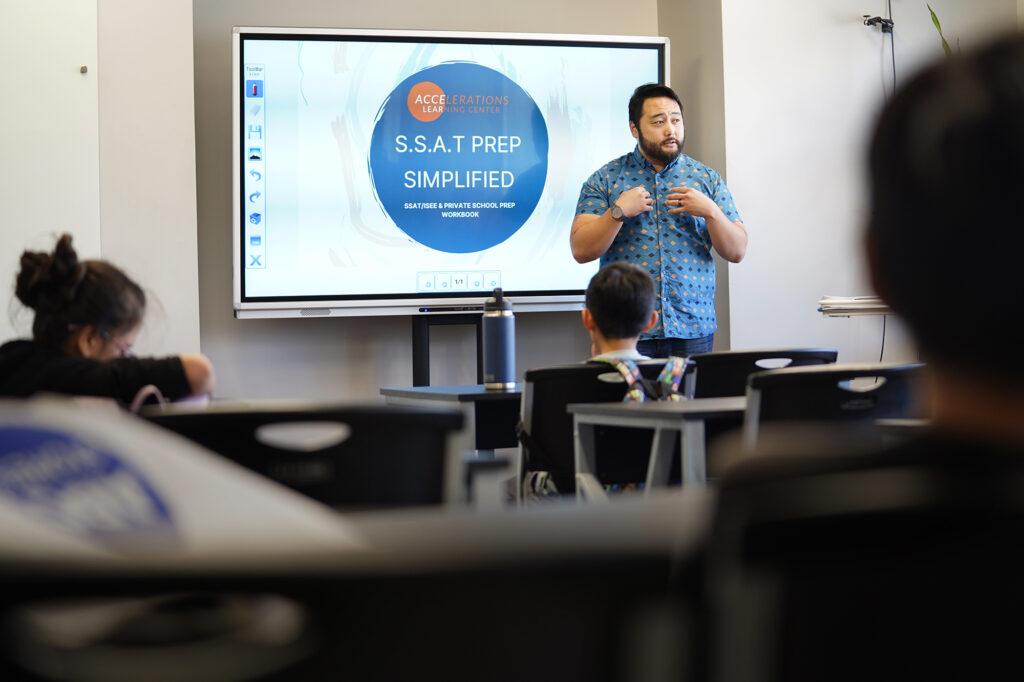 Brandt “Mr. B” Izumo leads a tutoring class Tuesday, Nov. 19, 2024, in Honolulu. (Kevin Fujii/Civil Beat/2024)