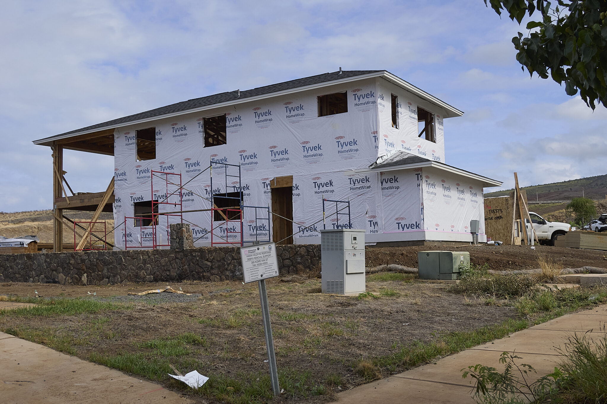 Below the Lahaina Bypass, not far from the memorial to the 102 Lahainanas lost on the fire of August 8th, 2023, developments are beginning to be rebuilt. Some owners have placed large Recreation vehicle on their lots, while others have progressed to various levels and are framing new homes and applying new roofs.  Building is a slow process but one that shows Lahaina neighborhoods are recovering.(David Croxford/Civil Beat/2025)