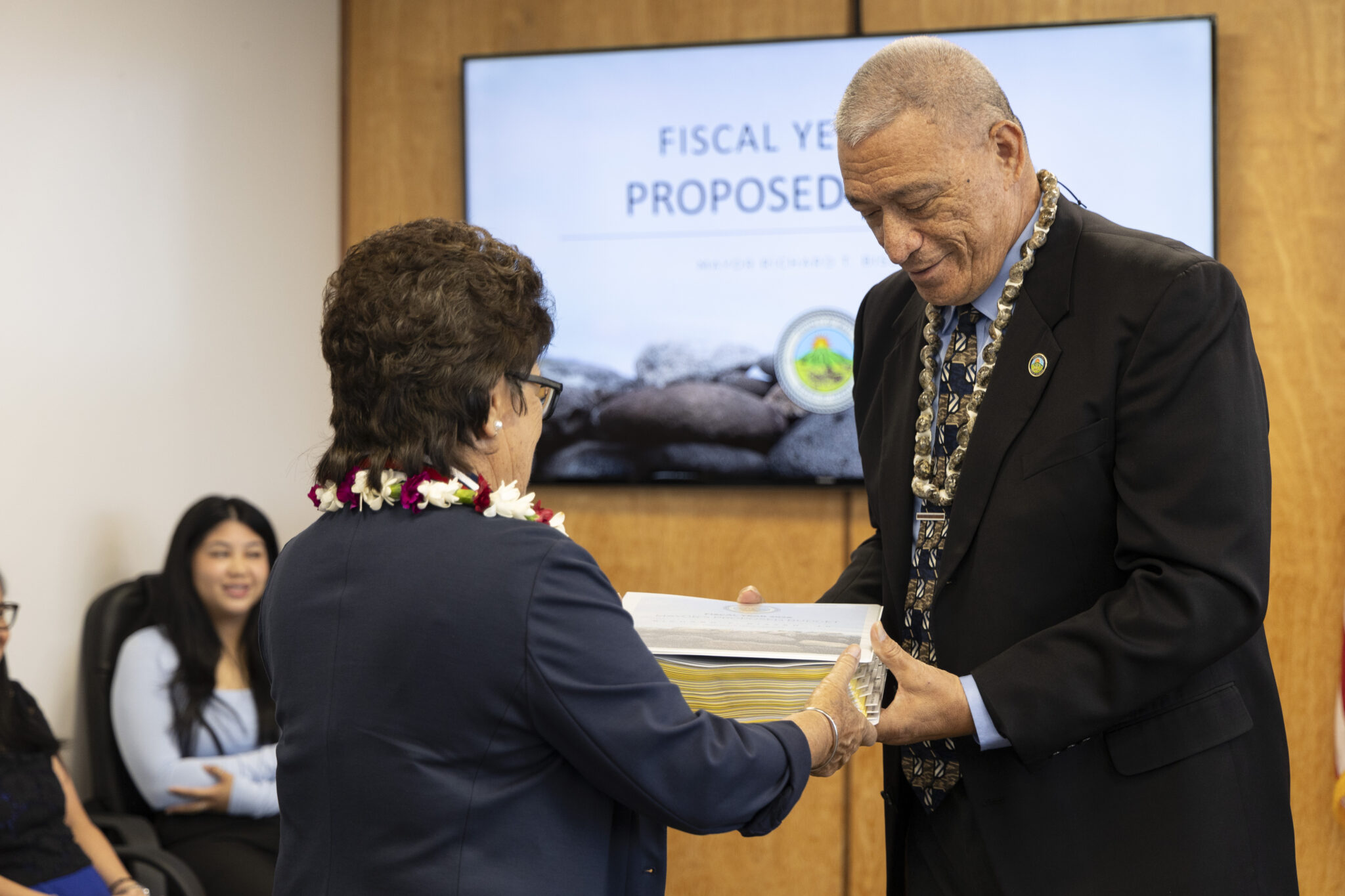 Maui Mayor Richard Bissen presented his proposed $1.51 billion budget for fiscal year 2026 to County Council Chair Alice Lee last week. (Courtesy: Maui County/2025)