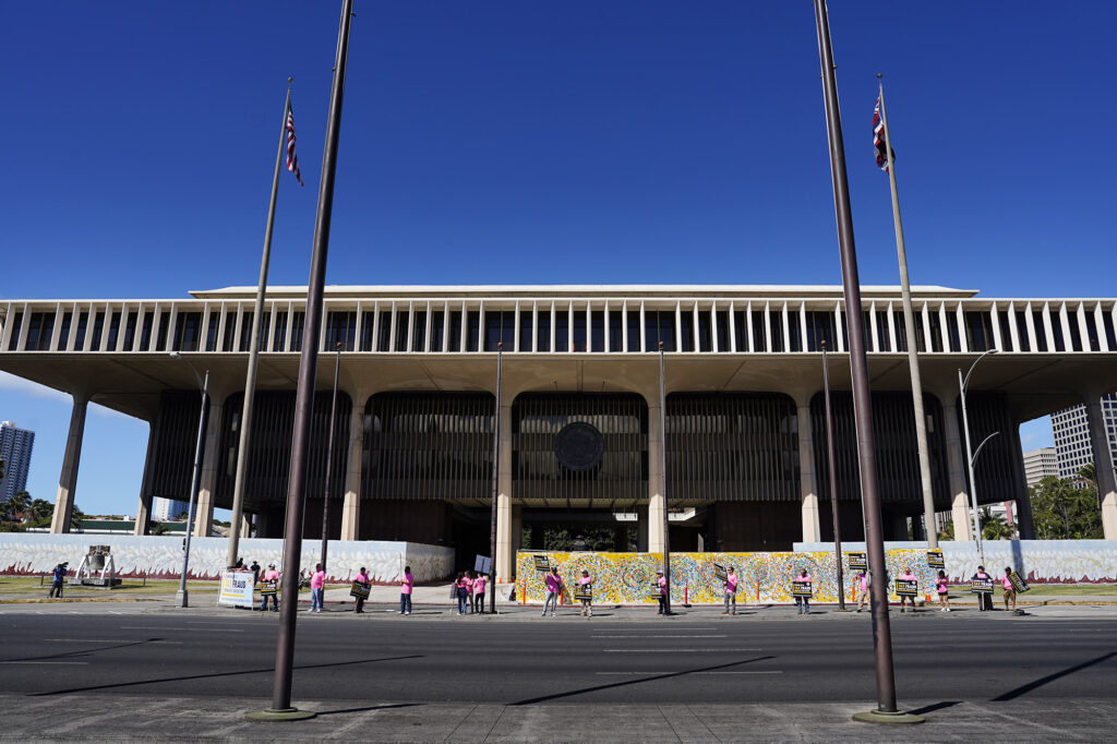 Union carpenters hold a rally in front of the Capitol protesting tax fraud in the construction industry Tuesday, April 15, 2025, in Honolulu. (Kevin Fujii/Civil Beat/2025)