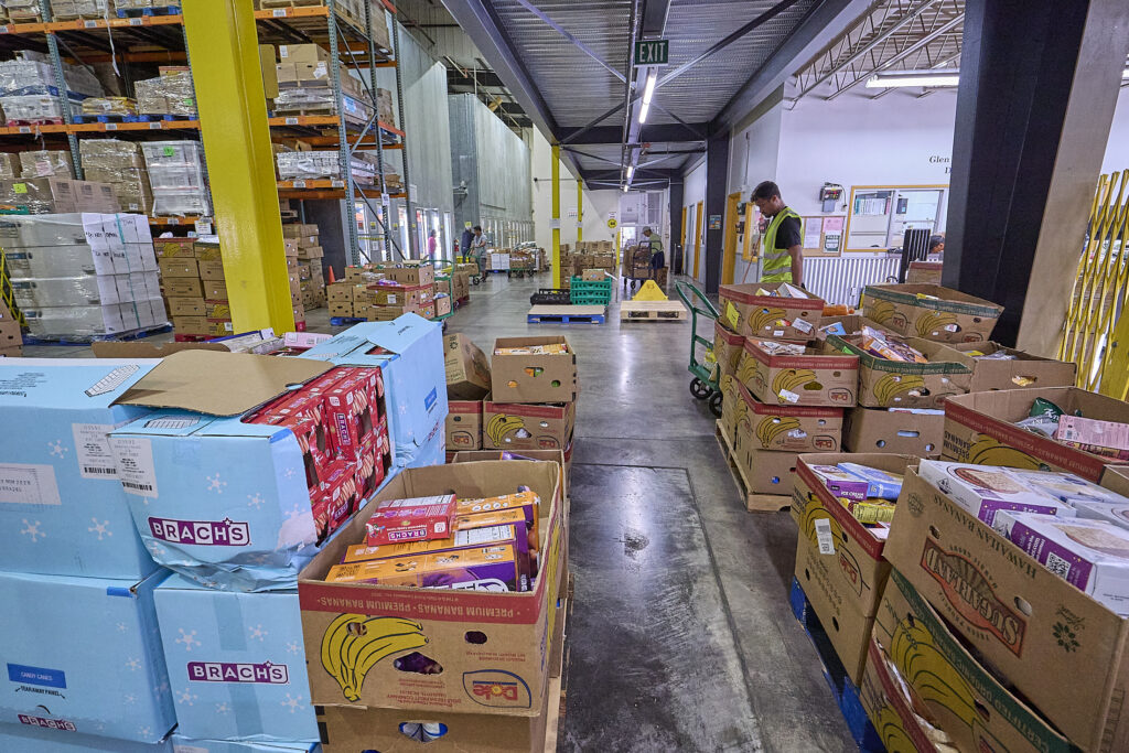 Views of the Hawaii Food Bank which delivers all manner of foods to many individuals and families from their warehouse on Kilihau Street. (David Croxford/Civil Beat/2025)