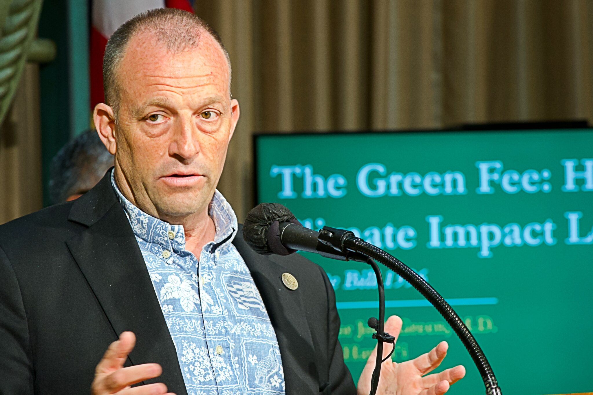 Governor Josh Green addresses a press conference before signing the climate change bill.
