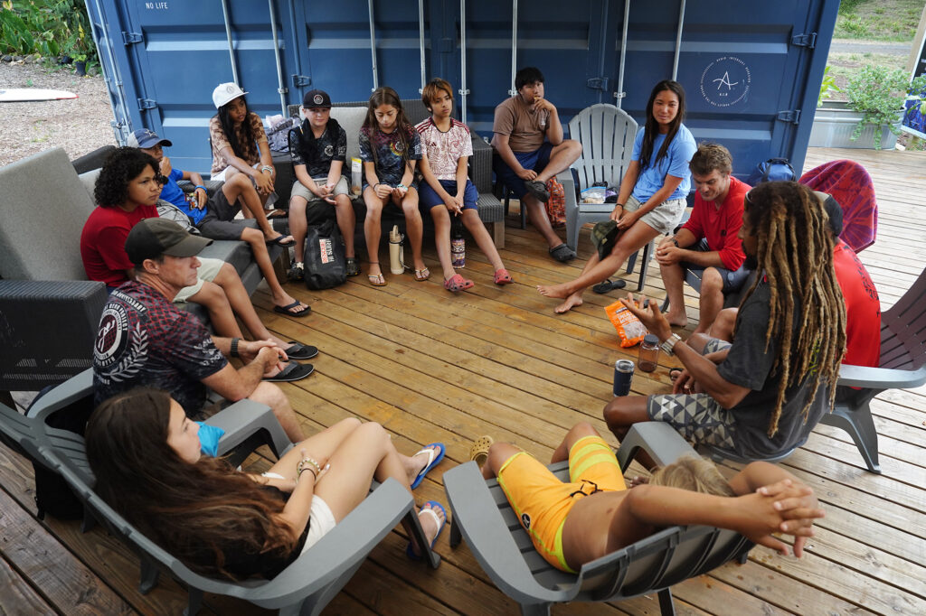 Maui Hero Project debriefs with Kahākūkahi Ocean Academy (KOA) after their water academy day Tuesday, June 10, 2025, in Lahaina. Some use this opportunity to work through the Maui fires from Aug. 8, 2023. (Kevin Fujii/Civil Beat/2025)