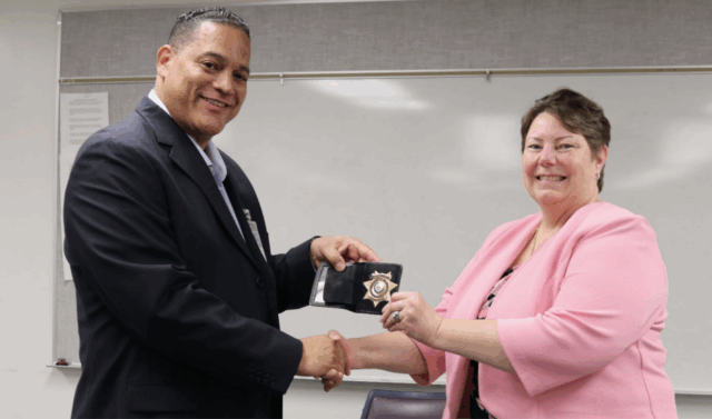 Department of Corrections and Rehabilitation Director Tommy Johnson with then-Deputy Director for Correctional Institutions Pamela Sturz in 2024. Sturz is alleging in a lawsuit filed Tuesday she faced discrimination because she is a gay white woman, and was finally fired after just 10 months on the job.