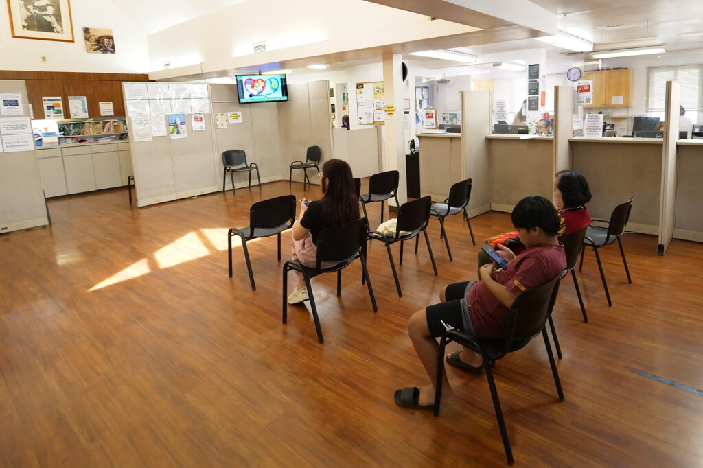 Patients in the waiting room of the 915 N. King St. Kalihi-Pālama Health Center on Tuesday, July 8, 2025. (Special to Honolulu Civil Beat Ronen Zilberman)