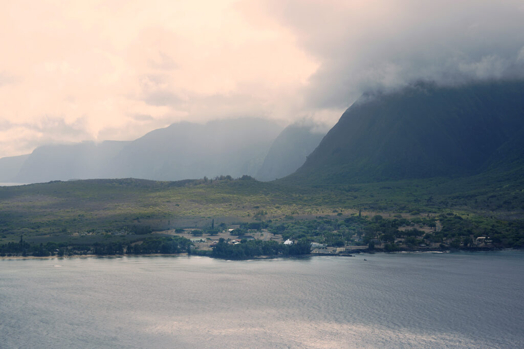 Kalaupapa is seen during the flight’s approach to the airport during the Kalaupapa Saints Tour Thursday, Sept. 18, 2025, in Kalaupapa. Covid closed Kalaupapa National Historical Park five years ago. Multiple state and federal agencies coordinated to allow a patient-owned tour company to bring visitors back. (Kevin Fujii/Civil Beat/2025)