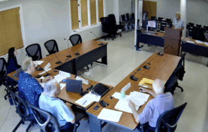 Bruce Douglas testifies from the podium about proposed rule changes during a Maui Board of Ethics meeting Wednesday. (Screenshot/Maui County/2025)