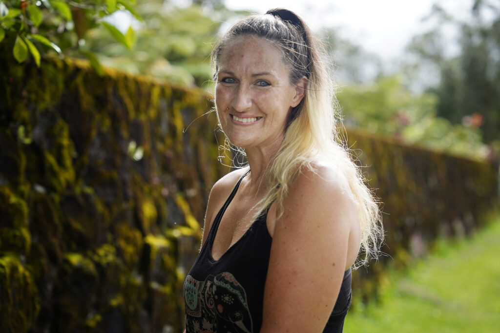 Heather Hofferbert and her dog Trippy are photographed Friday, Oct. 31, 2025, in Hilo. The two were staying in a domestic-abuse shelter and were forced to move to Hilo after funding was cut. (Kevin Fujii/Civil Beat/2025)