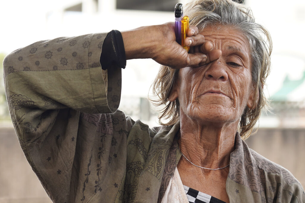 Yvonne Almond, a homeless woman staying in Chinatown, is photographed Tuesday, Nov. 4, 2025, in Honolulu. (Kevin Fujii/Civil Beat/2025)