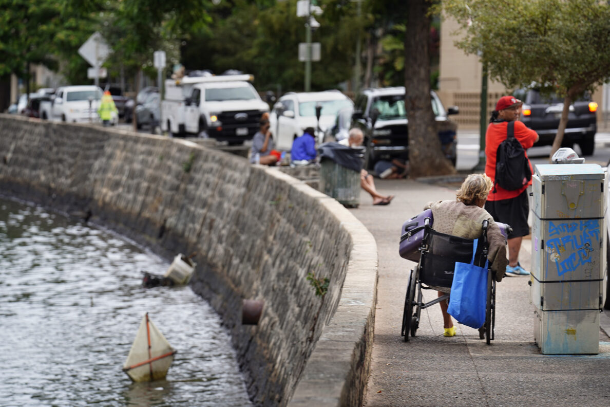 Yvonne Almond, who is homeless, moves along River Street in Chinatown Tuesday, Nov. 4, 2025, in Honolulu. (Kevin Fujii/Civil Beat/2025)