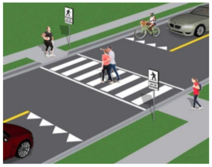 A clearer and more enhanced crossing to get cars to stop.