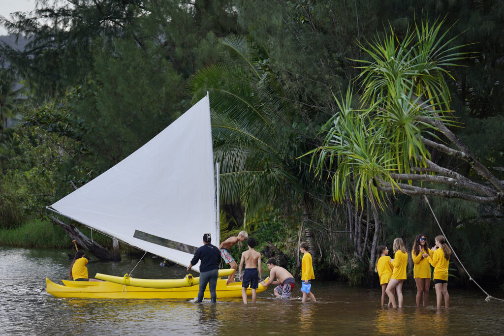 Namahana School students and volunteer take the wa‘a Titarella for an inaugural sail during an ʻāina based learning day at Hanalei Bay Wednesday, Nov. 19, 2025, in Hanalei. (Kevin Fujii/Civil Beat/2025)