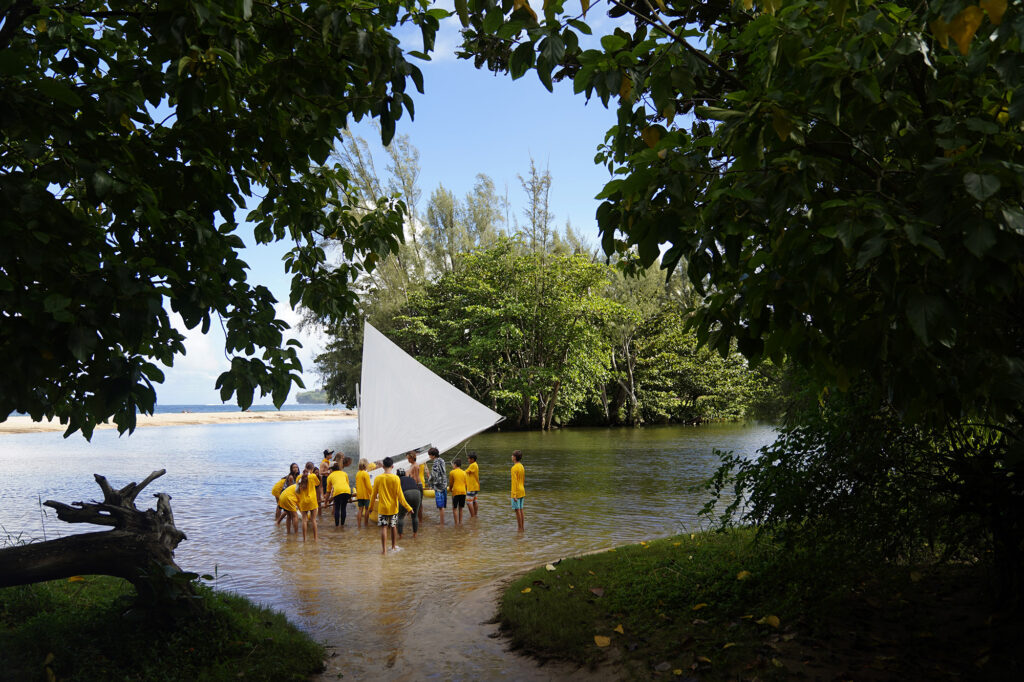 Namahana School students and volunteer take the wa‘a Titarella for an inaugural sail during an ʻāina based learning day at Hanalei Bay Wednesday, Nov. 19, 2025, in Hanalei. (Kevin Fujii/Civil Beat/2025)