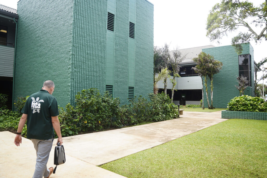 Hawaiʻi Technology Academy Kauaʻi Campus Director Nathaniel Evslin walks to a classroom Wednesday, Nov. 19, 2025, in a Līhuʻe office park. (Kevin Fujii/Civil Beat/2025)