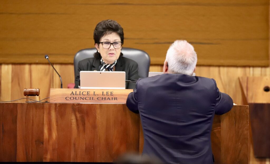 Maui County Council Chair Alice Lee talks to council member Tom Cook during a break on Monday. (Erin Nolan/Civil Beat/2025)