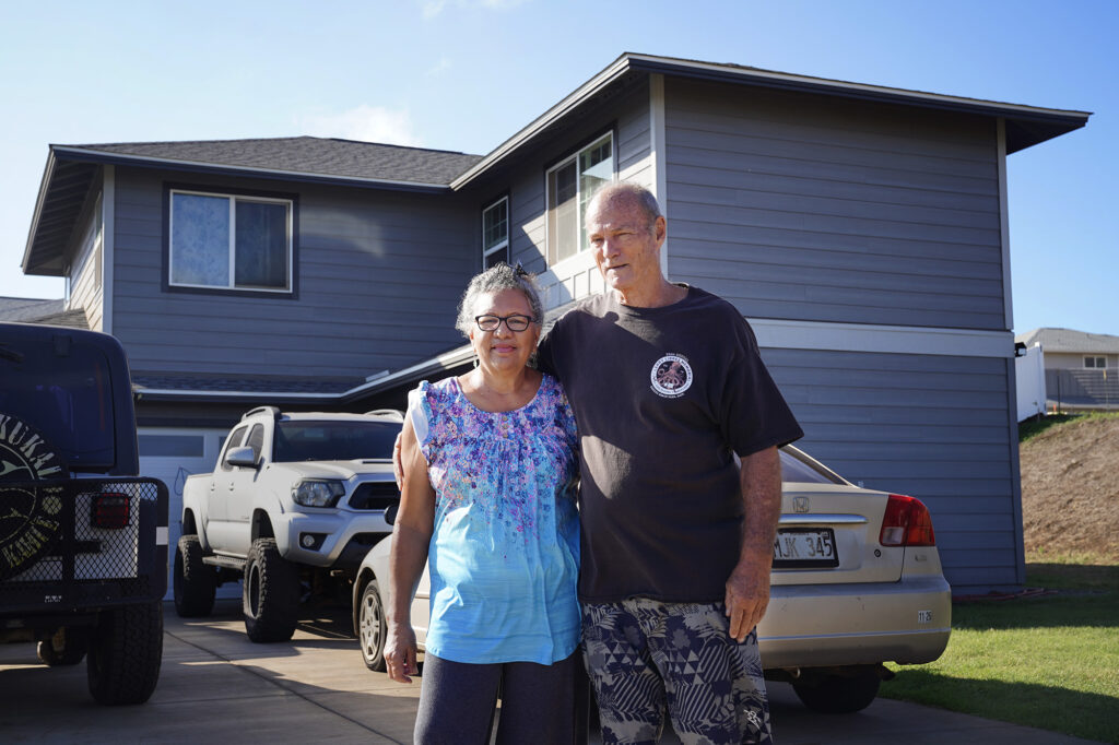 Jade and Michael Riley are photographed outside of their Puʻuhona subdivision home Saturday, Dec. 6, 2025, in Wailuku. (Kevin Fujii/Civil Beat/2025)