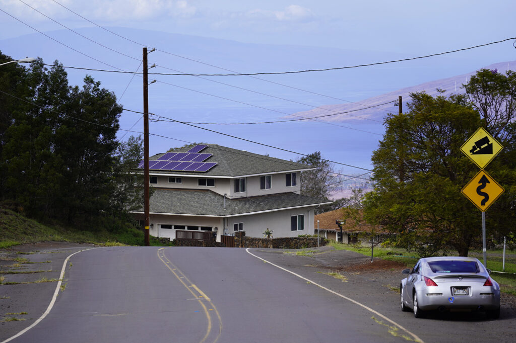 The island of Lānaʻi and Māʻalaea Bay offer a picturesque background to Waiohuli homes Saturday, Dec. 6, 2025, in Kula. (Kevin Fujii/Civil Beat/2025)