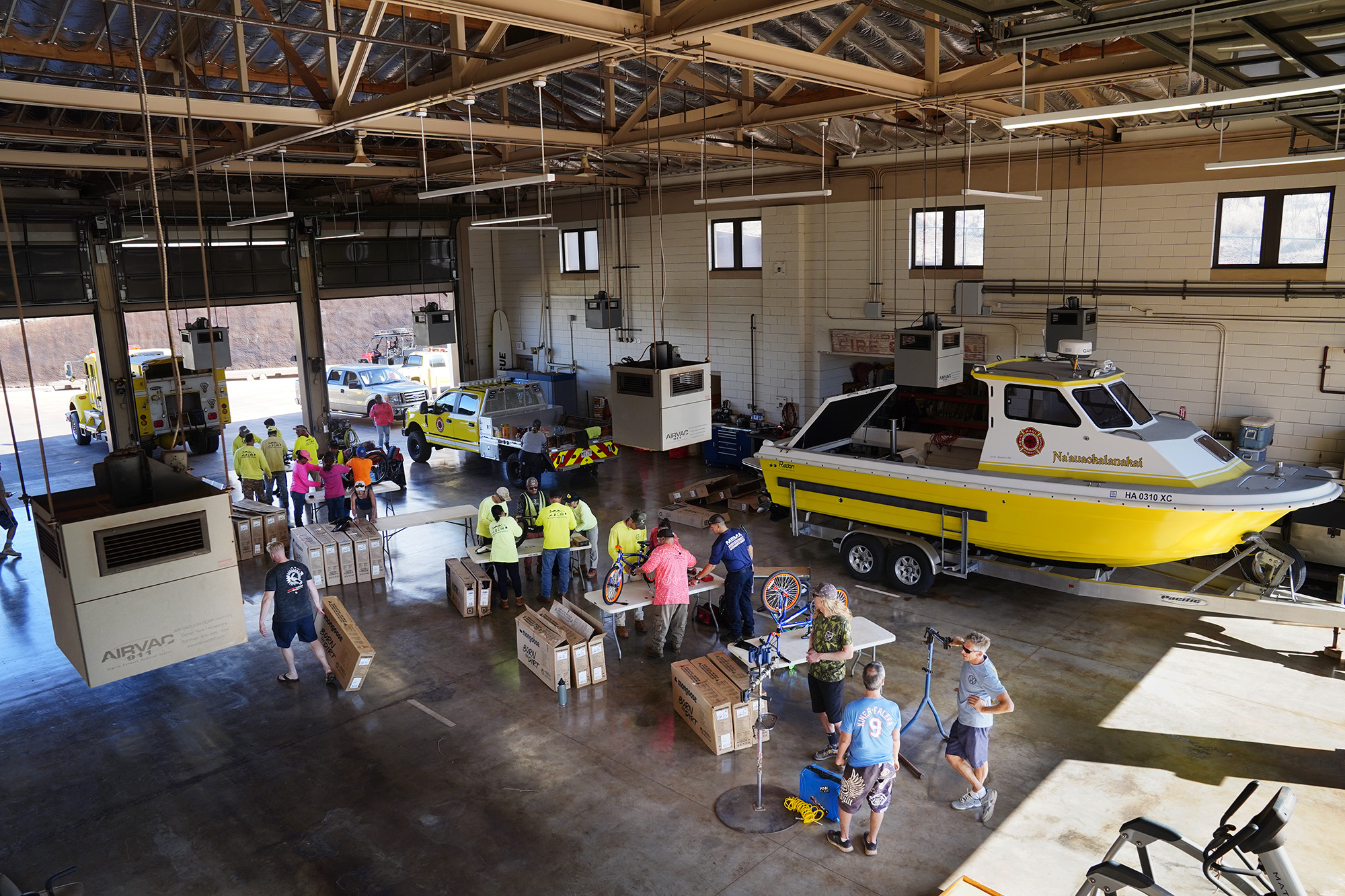 Jim Falk’s annual Christmas Kids Bike Build takes place in the Kaunakakai Fire Station Wednesday, Dec. 10, 2025, in Molokaʻi. Approximately 450 new bicycles are built and will distributed to keiki in Maui County. (Kevin Fujii/Civil Beat/2025)