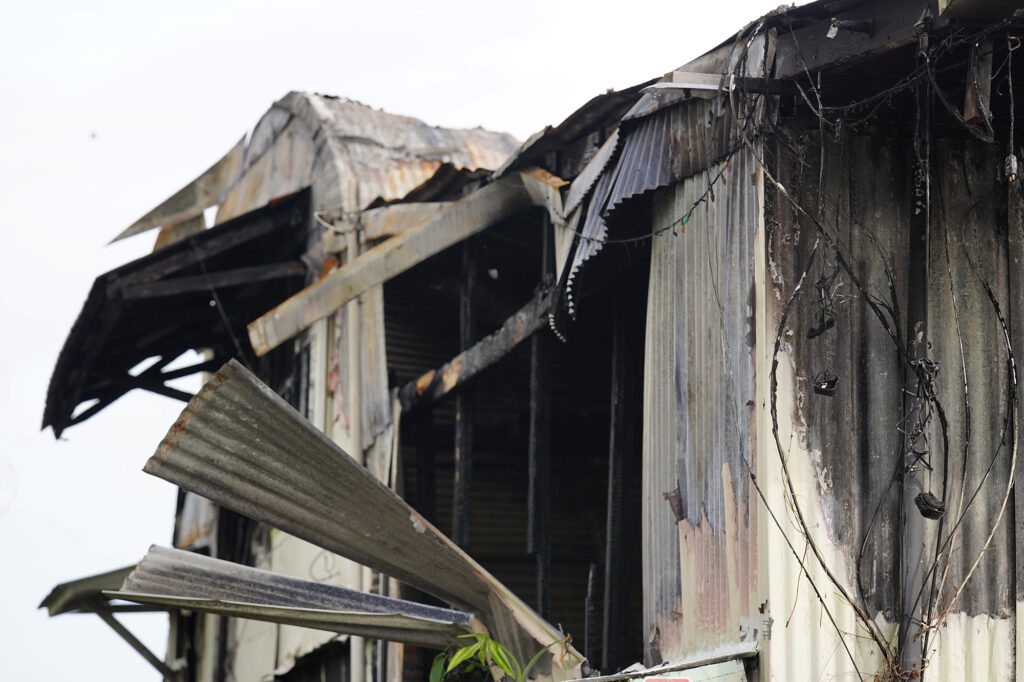 The aftermath of the former poi factor fire is photographed Tuesday, Dec. 16, 2025, in Hilo. Two women died at the former poi factory. (Kevin Fujii/Civil Beat/2025)