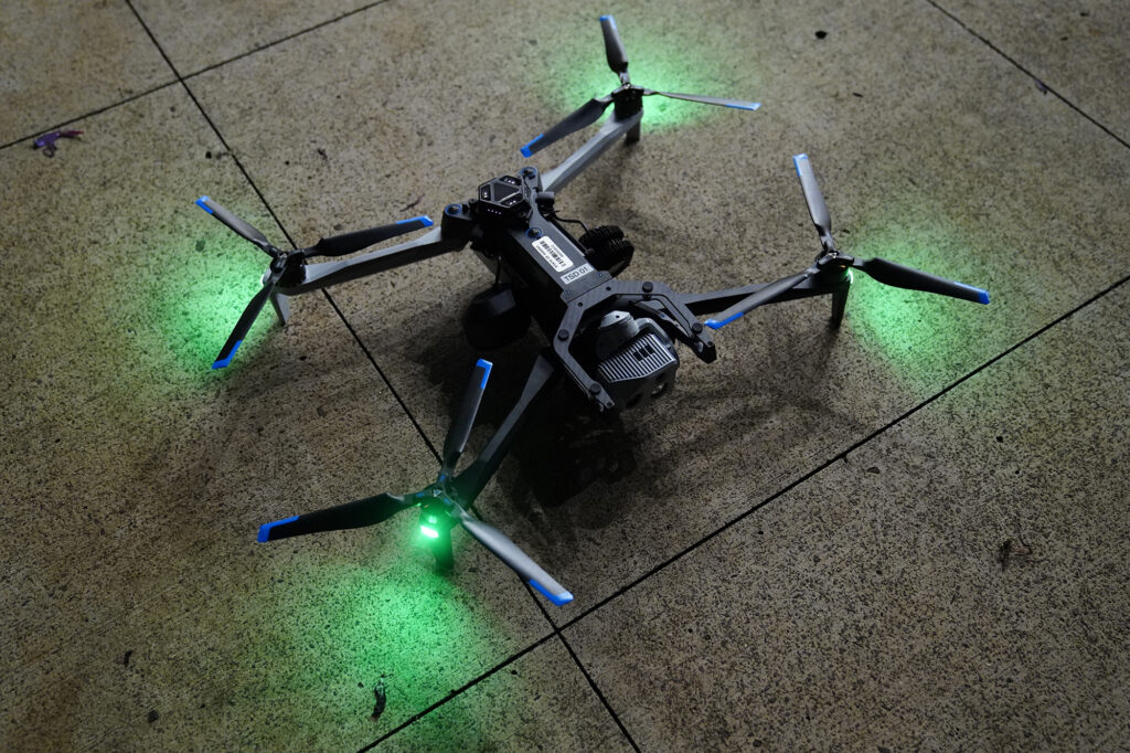 A drone lands before Department of Law Enforcement Director Mike Lambert takes journalists on a ride along Wednesday, Dec. 31, 2025, in Waipahu. New laws, the use of aerial drones and citizens heeding the dangers of fireworks noticeably  curbed the annual personal pyrotechnics. (Kevin Fujii/Civil Beat/2025)