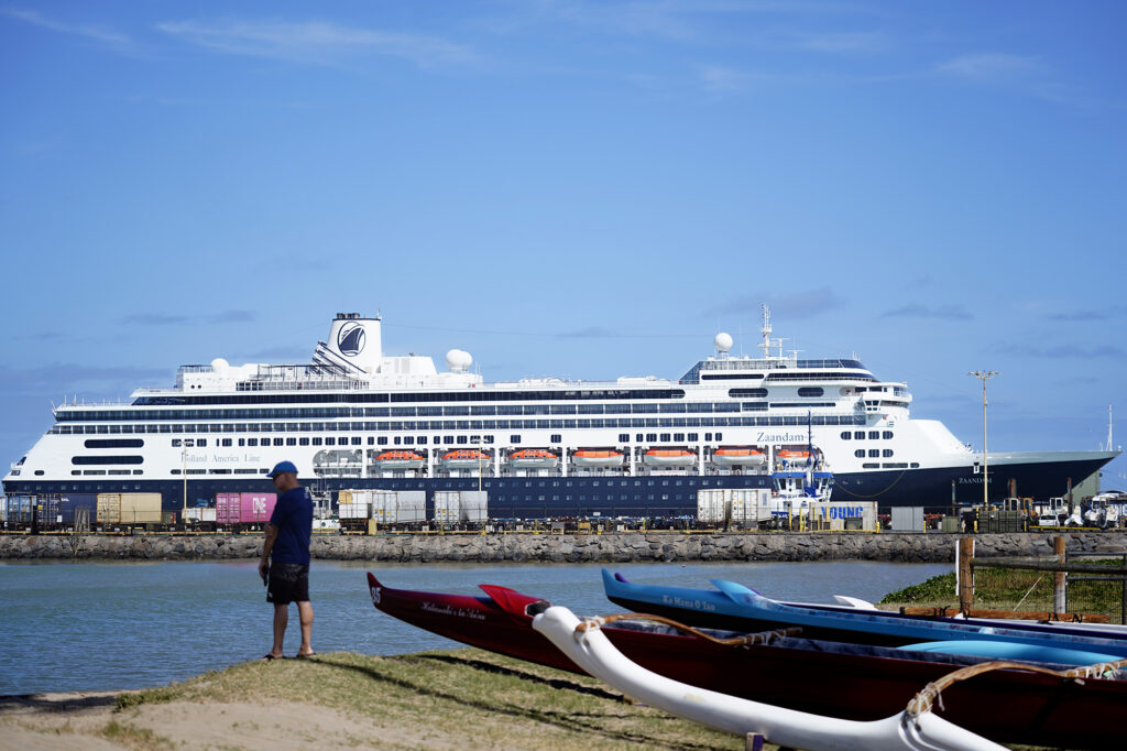 The Holland American Line Zaandam cruise ship docks Tuesday, Jan. 13, 2026, in Kahului Harbor on Maui. The giant cruise ship is juxtaposed with Na Kai Ewalu Canoe Club’s outrigger canoes in the foreground. (Kevin Fujii/Civil Beat/2026)
