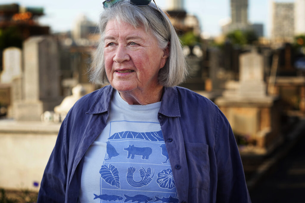 Laura Ruby is photographed at the Mōʻiliʻili Japanese Cemetery Friday, Jan. 9, 2026, in Honolulu. Ruby opposes the pedestrian bridge over the Ala Wai Canal connecting Mōʻiliʻili and Waikīkī. (Kevin Fujii/Civil Beat/2026)
