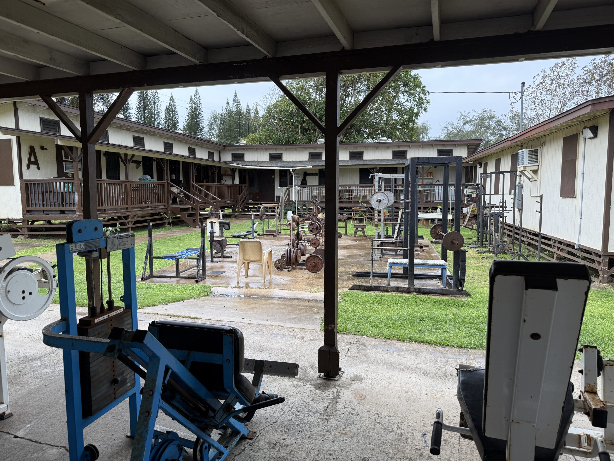 Kaua‘i Commubity Correctional Center's Wailua facility includes three cabins that were added as temporary structures after Hurricane Iniki. Fronting them is an outdoor recreation space.