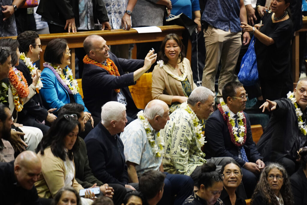 Gov. Josh Green makes a selfie with U.S. Sens. Mazie Hirono, Brian Schatz and Lt. Gov. Sylvia Luke before the Hawaiʻi State Legislature opens Wednesday, Jan. 21, 2026, in Honolulu. (Kevin Fujii/Civil Beat/2026)