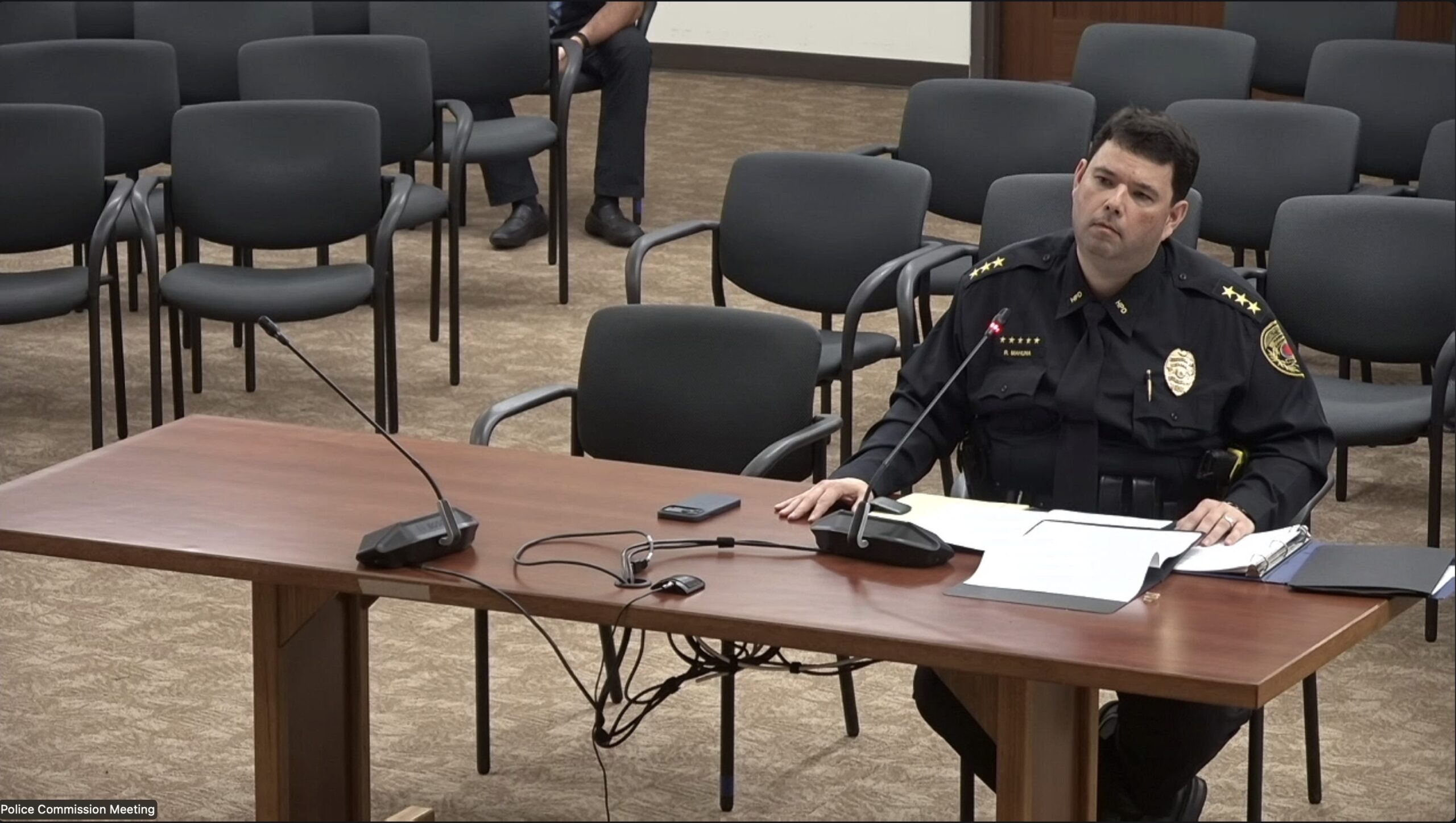 Reed Mahuna sat in front of the Police Commission during a seven-hour hearing on Thursday. The commission chose him as chief Friday morning after interviewing eight finalists. (Taylor Cozloff/Civil Beat/2026)