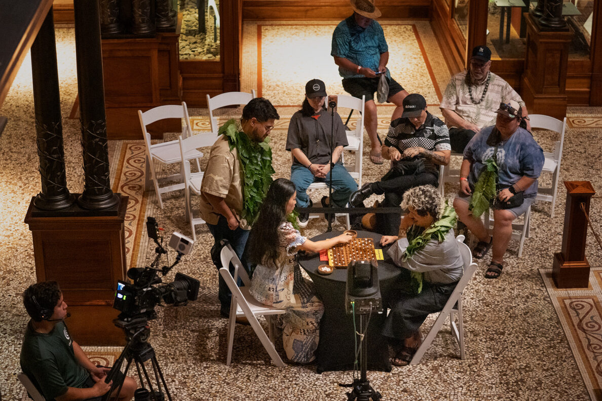 Yuna Inoue, left of Hawaiʻi Island, plays Oʻahu’s Kapena Baptista during the semifinals of the inaugural Ka Makou Kōnane Invitational Tournament at the Bishop Museum Friday, Feb. 13, 2026, in Honolulu. (Kevin Fujii/Civil Beat/2026)