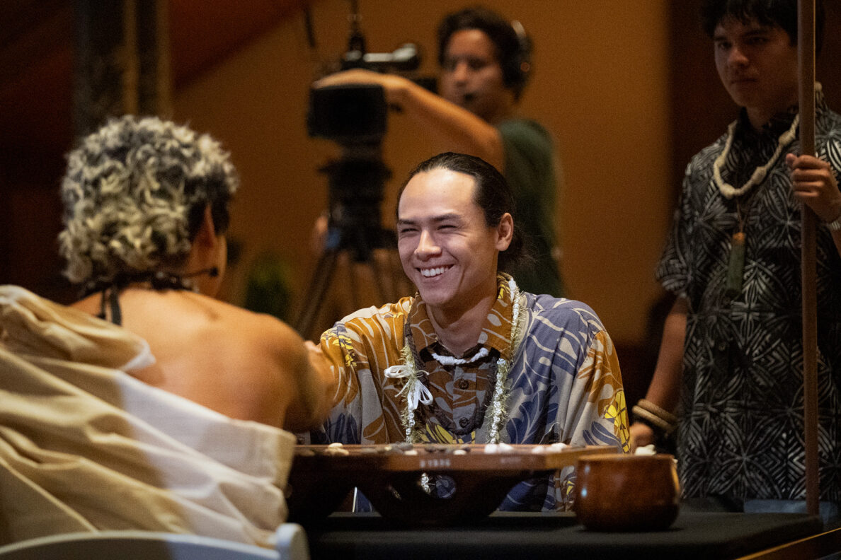 Kahekili Yung, center, congratulates Kapena Baptista, left, for defeating him to win the inaugural Ka Makou Kōnane Invitational Tournament at the Bishop Museum Friday, Feb. 13, 2026, in Honolulu. (Kevin Fujii/Civil Beat/2026)