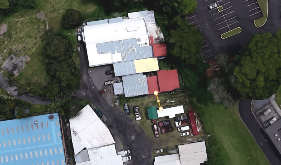 An aerial view of the old Puʻueo Poi Factory at 265-D Kekūanāoʻa Street in Hilo. The building with the white roof joined by a dotted line was approved for county housing assistance.