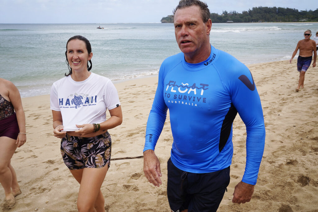 Kyla Yoder of Kapaʻa, left, and ocean safety educator Bruce “Hoppo” Hopkins of Australia, talk about her experience in Hawai‘i’s first rip current clinic at Waiʻoli Beach Park Wednesday, Feb. 18, 2026, in Hanalei. (Kevin Fujii/Civil Beat/2026)