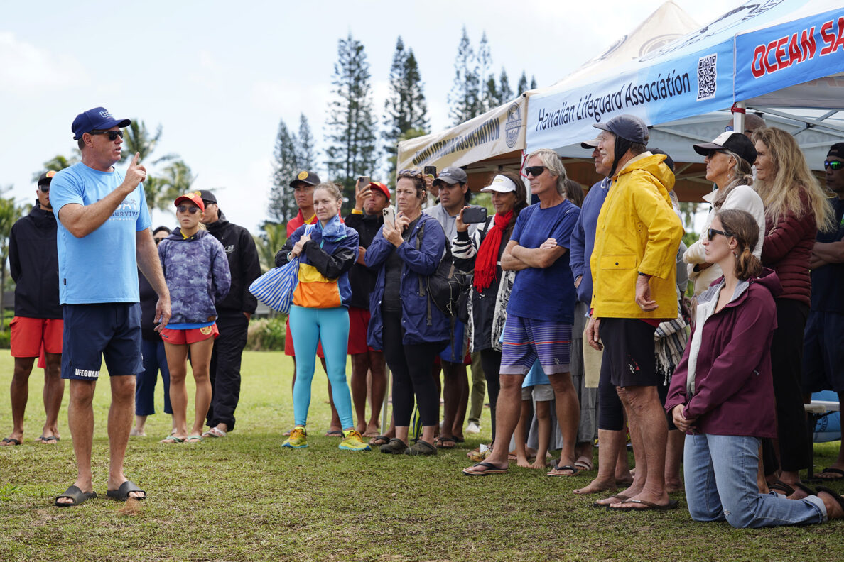 Ocean safety educator Bruce “Hoppo” Hopkins of Australia, reminds rip current clinic participants to not panic during the state’s first rip current clinic at Wai‘oli Beach Park Wednesday, Feb. 18, 2026, in Hanalei. The Kaua‘i Ocean Safety Bureau, Kaua‘i Lifeguard Association and the Hawaiian Lifeguard Association invited Hopkins and a group from the Okinawa Lifesaving Association to educate the public on how to work with, instead of fight, a rip current. (Kevin Fujii/Civil Beat/2026)