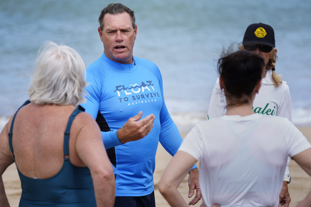 Ocean safety educator Bruce “Hoppo” Hopkins of Australia, reminds rip current clinic participants to float during the state’s first rip current clinic at Wai‘oli Beach Park Wednesday, Feb. 18, 2026, in Hanalei. The Kaua‘i Ocean Safety Bureau, Kaua‘i Lifeguard Association and the Hawaiian Lifeguard Association invited Hopkins and a group from the Okinawa Lifesaving Association to educate the public on how to work with, instead of fight, a rip current. (Kevin Fujii/Civil Beat/2026)