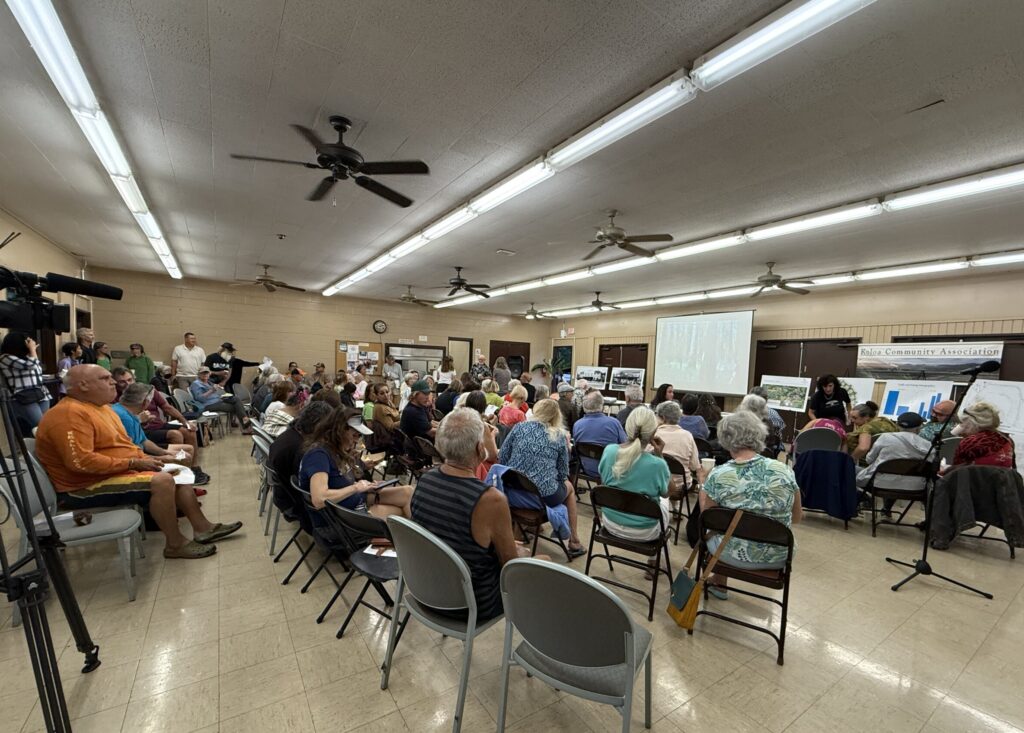 Over 100 community members attended a Feb. 18 Kōloa Community Association meeting to learn more about a proposed 148-unit housing project at the corner of Weliweli and Waikomo roads. The site is meant to be a transition zone between the town’s commercial center and residential neighborhoods. (Noelle Fujii-Oride/Civil Beat/2026)