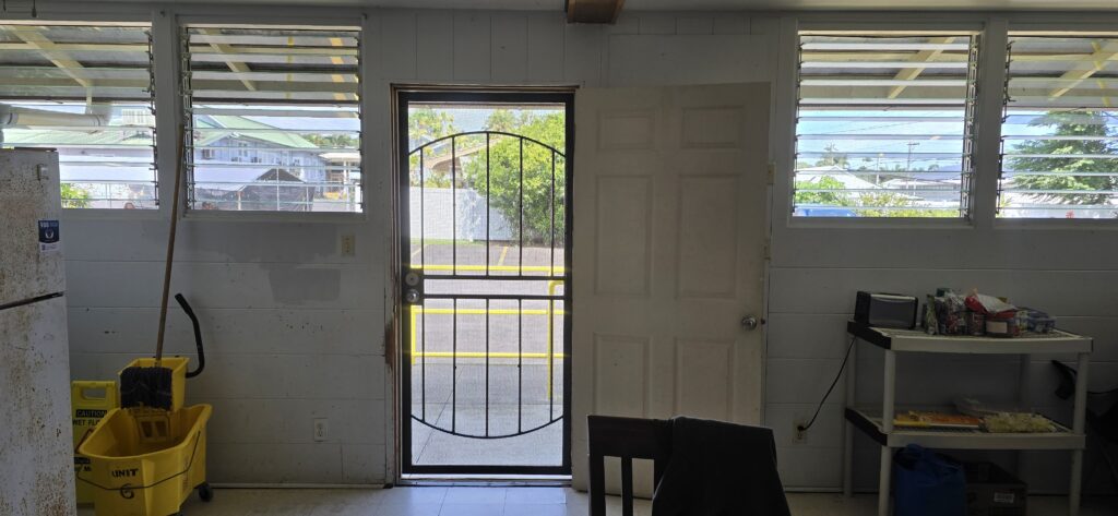 Photo of living unit at Hale Maluhia, an emergency housing shelter at 110 Ululani St. Hilo. Each unit has only one exit and entrance, and no alternative exit in the event of fire.