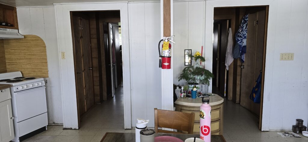 Photo of living unit at Hale Maluhia, an emergency housing shelter at 110 Ululani St. Hilo. Each unit has only one exit and entrance, and no alternative exit in the event of fire.