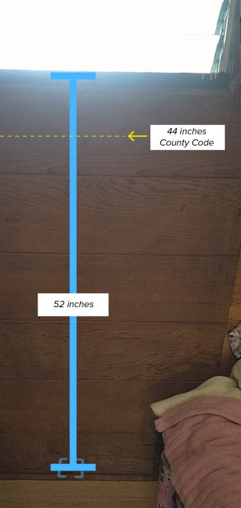 Measurement of rear window sills in Hale Maluhia, an emergency shelter for women in Hilo. The lower sill exceeds the maximum height in the county code. Photo enhanced by Civil Beat for comparison.