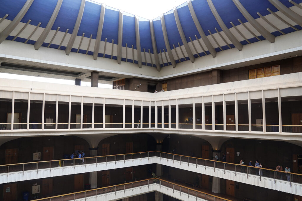 An overall generic photograph of people milling about the balconies of the Capitol Tuesday, March 17, 2026, in Honolulu.