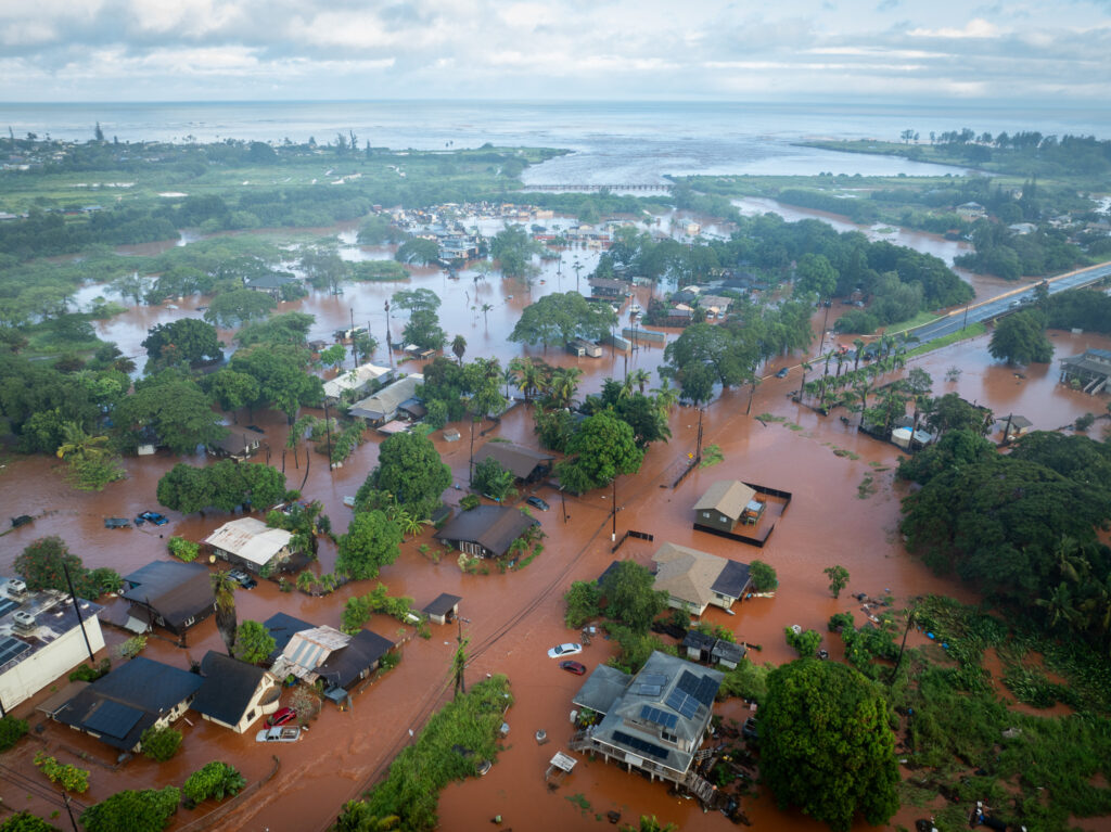 Floodwaters inundate Haleiwa March 20, 2026. Saturated ground and persistent rain from a Kona-low front caused flooding overnight. (Craig Fujii/Civil Beat/2026)