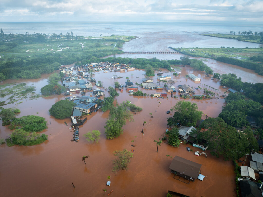 Floodwaters inundate Haleiwa March 20, 2026. Saturated ground and persistent rain from a Kona-low front caused flooding overnight. (Craig Fujii/Civil Beat/2026)