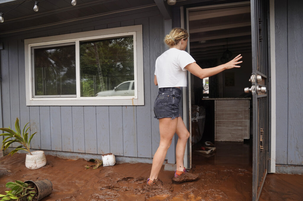India Myercough (808-780-0810) enters her studio Saturday, March 21, 2026, in Waialua. Myercough was flooded by both Kona Low storms. (Kevin Fujii/Civil Beat/2026)