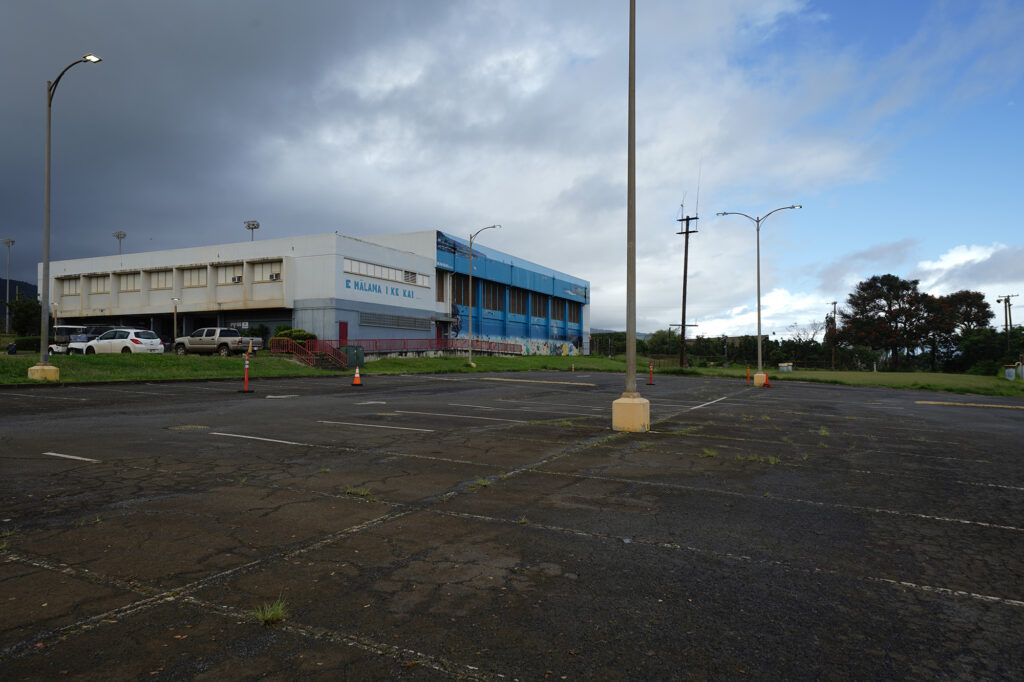 Waialua High & Intermediate School parking lot remains empty Monday, March 23, 2026, in Waialua. The second Kona low storm prevents students from returning to campus after many were flooded. (Kevin Fujii/Civil Beat/2026)