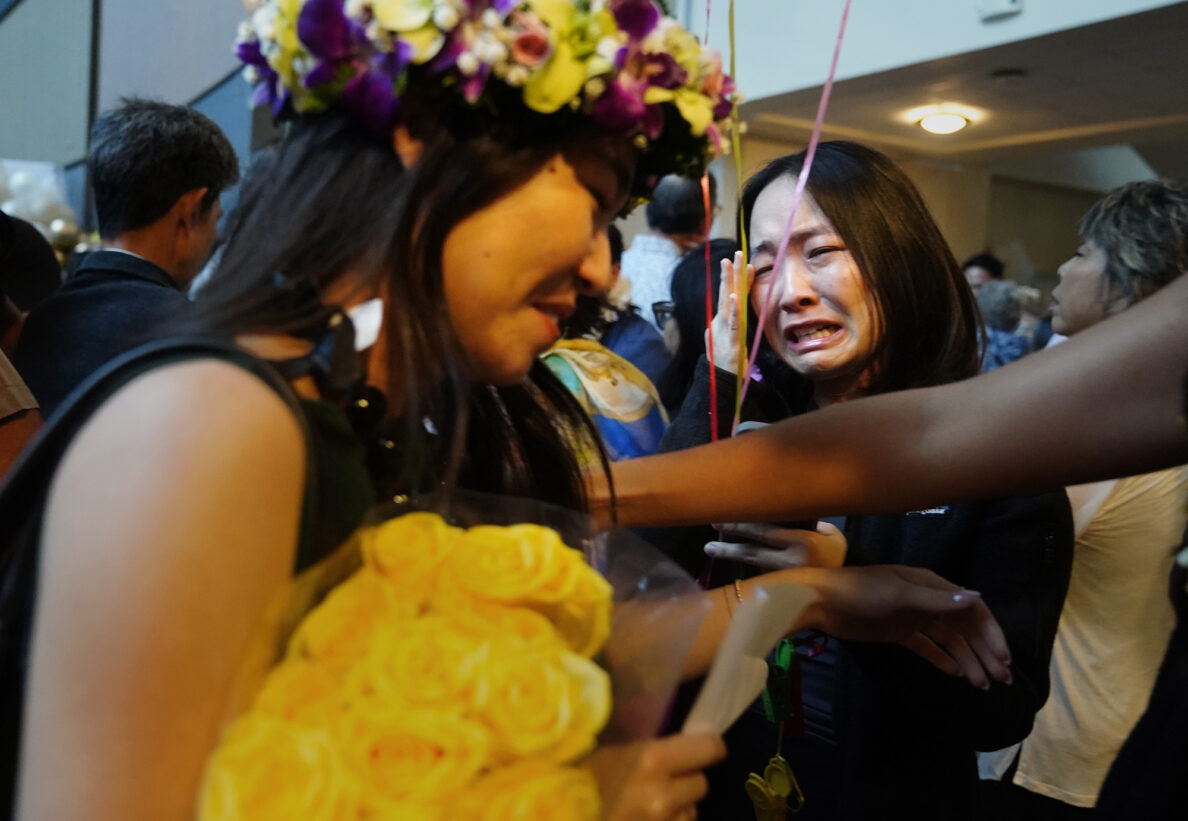 John A. Burns School of Medicine second-year student Kasey Emoto, right, sheds tears of joy for her sister fourth-year student Jamie Emoto after she matched with UC Irvine  Medical Center on “Match Day” Friday, March 20, 2026, in Honolulu. Jamie will continue training in pediatrics. The Emoto sisters are from Lihue. (Kevin Fujii/Civil Beat/2026)