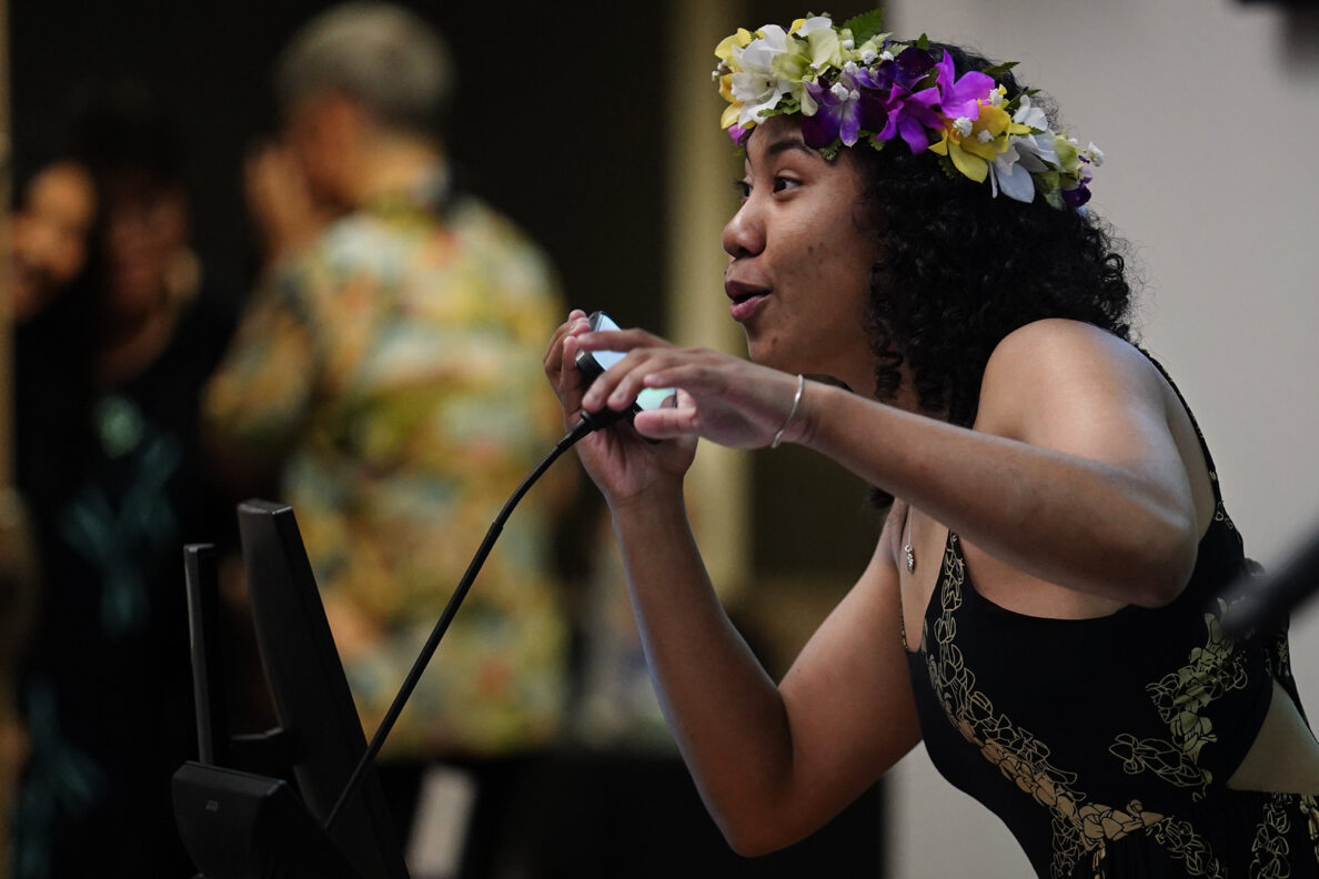 John A. Burns School of Medicine fourth-year student and class president D-Dré Wright raps to her classmates before handing out letters for “Match Day” Friday, March 20, 2026, in Honolulu. Wright is going into orthopedic surgery at Cedars-Sinai Medical Center in Los Angeles. (Kevin Fujii/Civil Beat/2026)