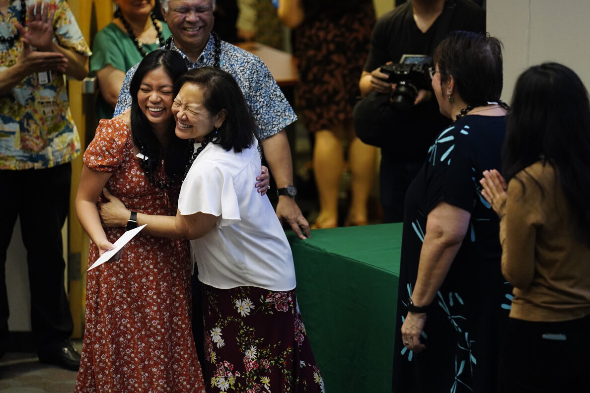 John A. Burns School of Medicine fourth-year student Jasmine Agustin Padamada of Kea‘au, left, hugs Jill Omori, the Director of Office of Medical Education, after receiving her letter for “Match Day” Friday, March 20, 2026, in Honolulu. Padamada is going to the University of Utah Health for Medicine-Pediatrics. (Kevin Fujii/Civil Beat/2026)