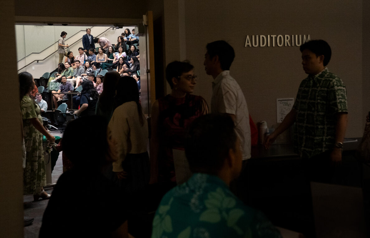 John A. Burns School of Medicine fourth-year students and one family member enter the auditorium before receiving their letters for “Match Day” Friday, March 20, 2026, in Honolulu. The graduating medical students find out where they will continue their medical training as residents. (Kevin Fujii/Civil Beat/2026)