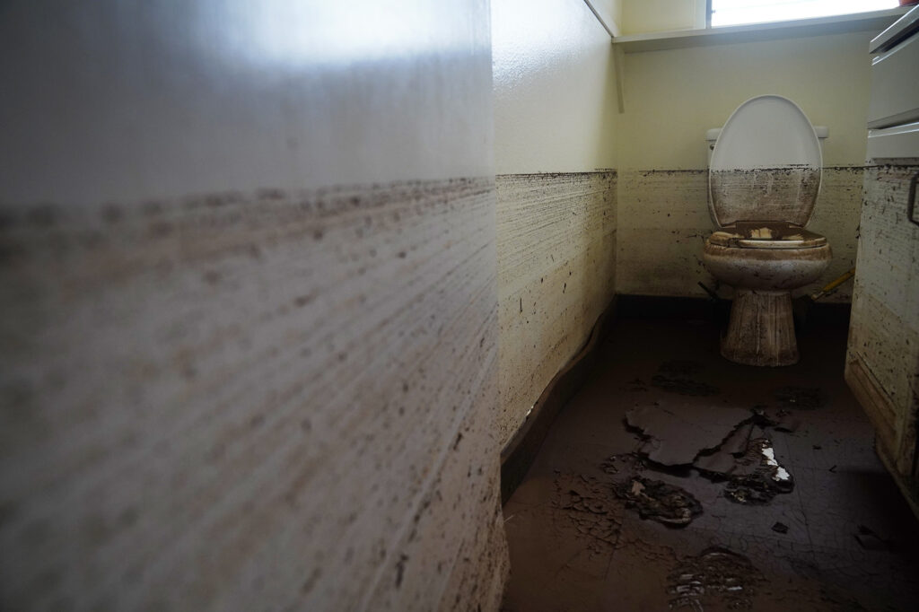 A restroom in the Ka‘ala Healing Arts building next to the Otake Bridge shows were Kaukonahua Stream floodwaters reached Wednesday, March 25, 2026, in Waialua. The former plantation residential neighborhood received damage from the second Kona Low storm. (Kevin Fujii/Civil Beat/2026)